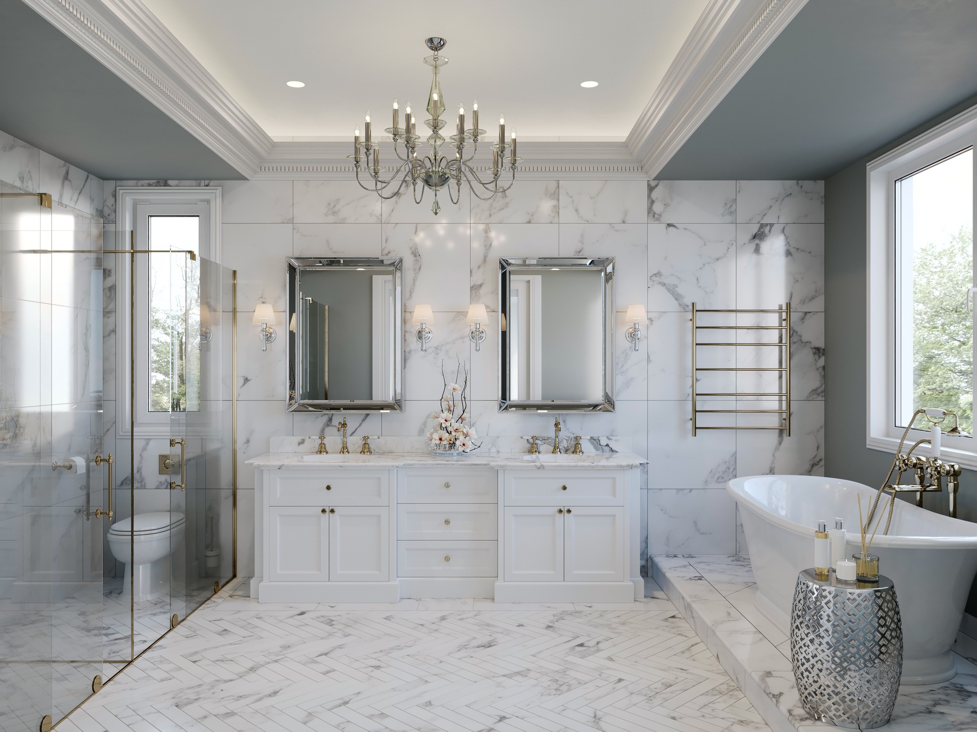 A luxurious bathroom with marble walls and floors, featuring a double vanity with two large mirrors, a glass-enclosed shower, a freestanding bathtub near a window, a chandelier, and elegant fixtures. The room is brightly lit and has a sophisticated, clean design.