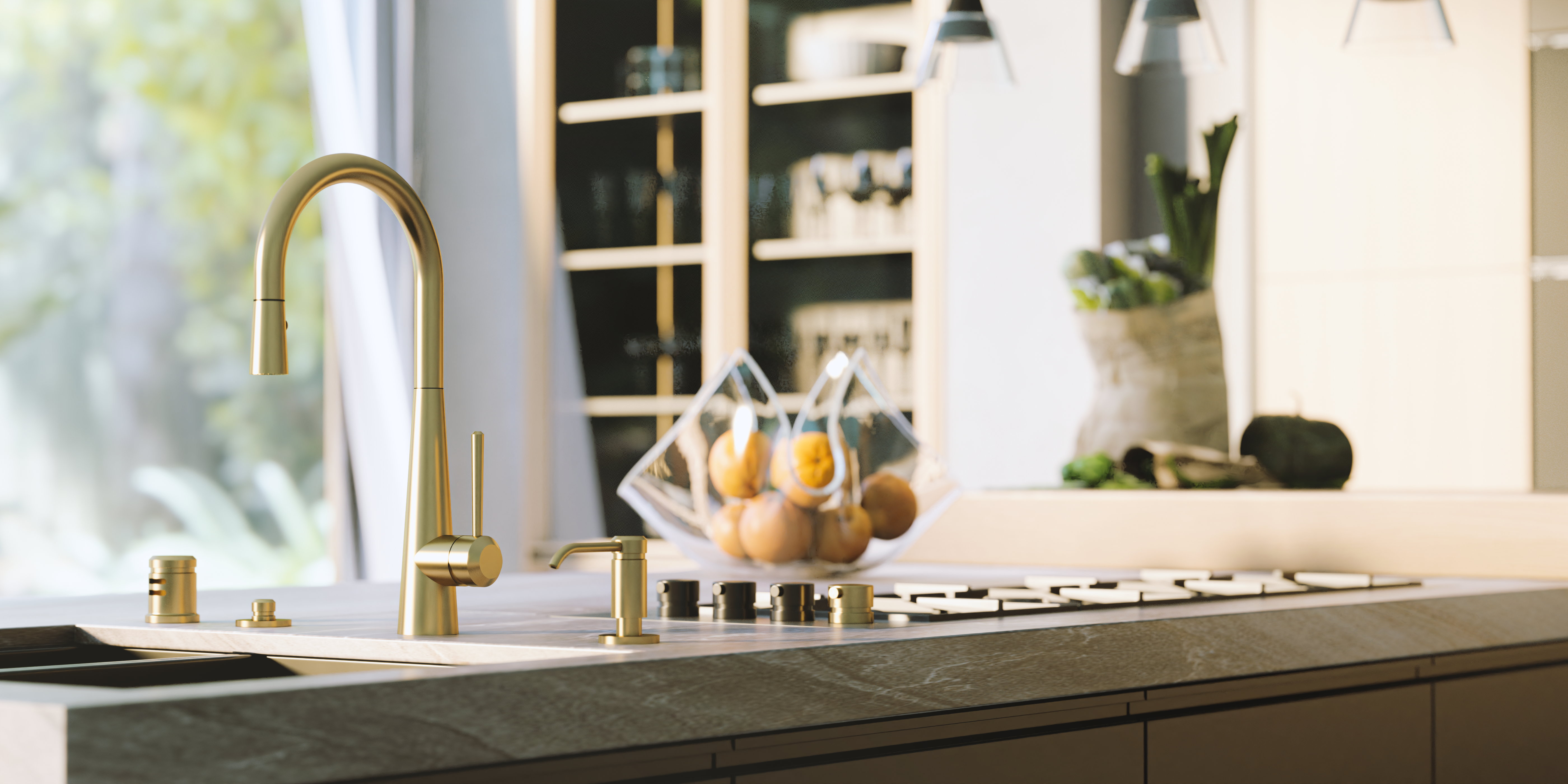 A modern golden faucet with a range and a bowl of oranges behind it